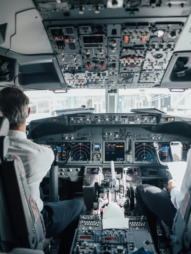 Man Sitting Inside a Cockpit of an Airplane